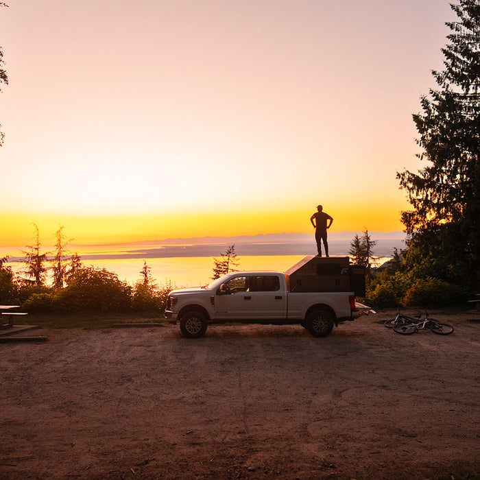 Freedom Camper at a campsite during sunset